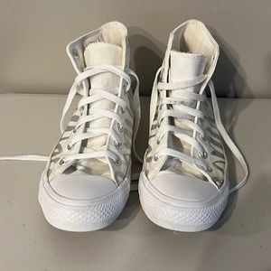 White and silver Chuck Taylor high tops